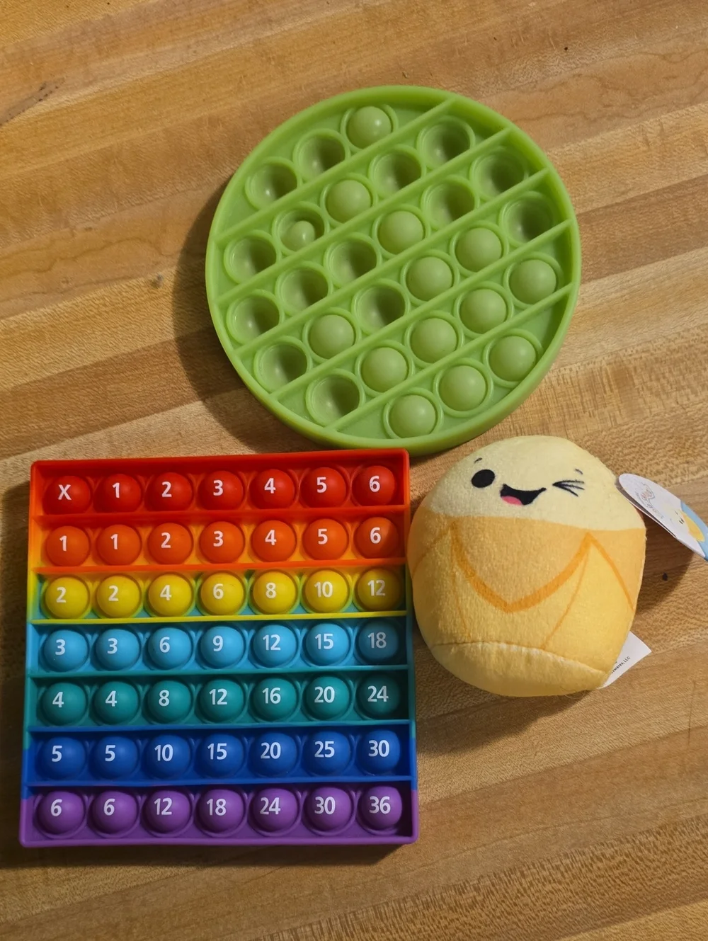Rainbow Popit Counting Fidget Toy, Green Circle, and Junie Squishmallow Plush